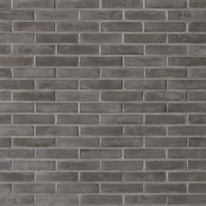 Parement mural en Brique Chromatik anthracite Orsol, briquette reconstituée à texture lisse posée en panneresse – produit Matiera Orsol vendu par Orpa Matériaux (Elaustore).