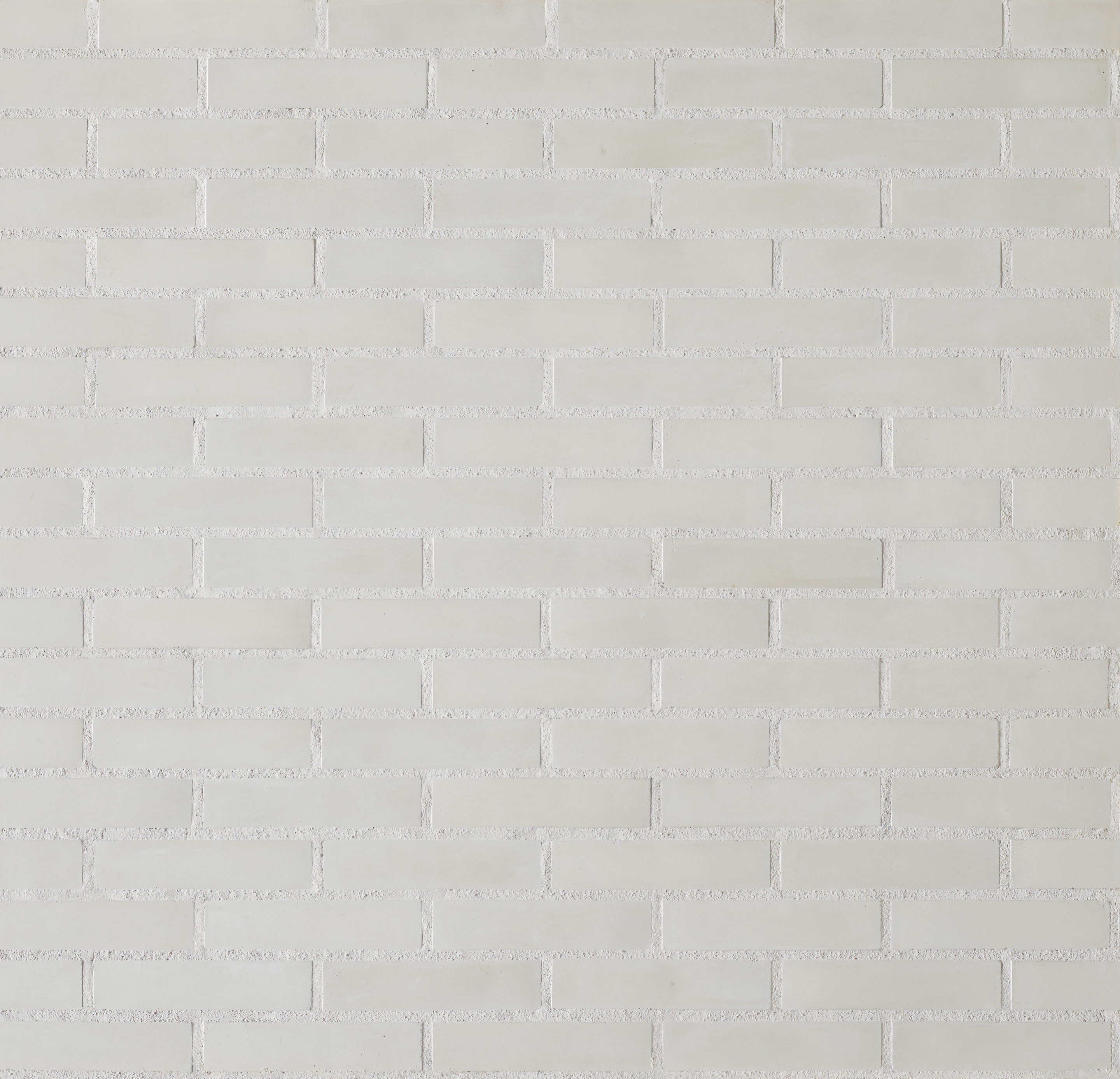 Parement mural en brique Chromatik White Orsol, briquette reconstituée à texture lisse posée en panneresse – produit Matiera Orsol vendu par Orpa Matériaux (Elaustore).